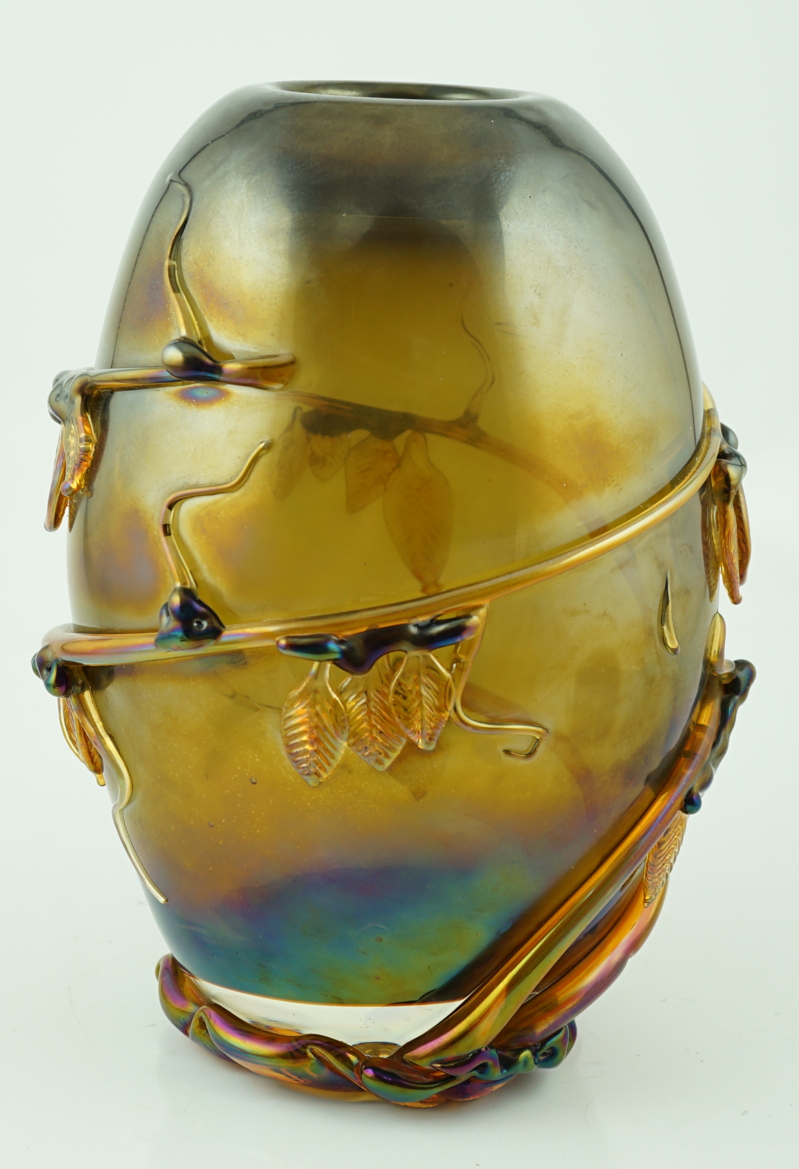 A Murano amber glass ovoid shaped vase, entwined with leaves